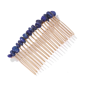 Detail of blue natural stone gravel hand-woven on golden metal bridal hair comb