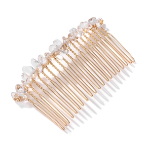 Detailed macro view of a 20-tooth gold alloy bridal hair comb with clear natural stones