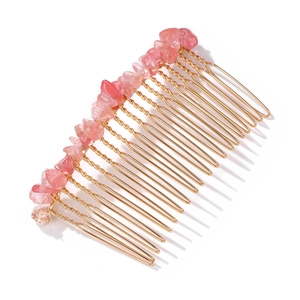 Detail of pink crystal chips hand-woven on a 20-tooth gold metal bridal hair comb