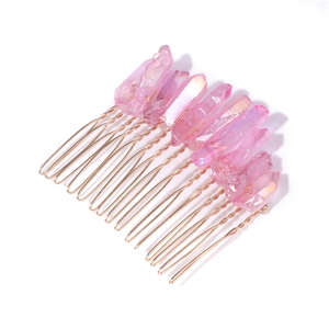 Detail view of handmade rose gold hair comb with pink raw crystal stones for bridal hair styling