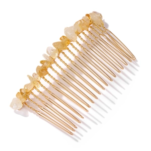 Detailed view of handmade gold wire hair comb featuring natural translucent yellow stones