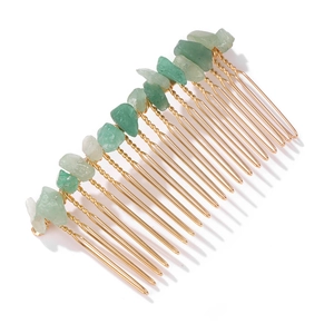 Detail of green raw stones hand-wired to a golden metal bridal hair comb