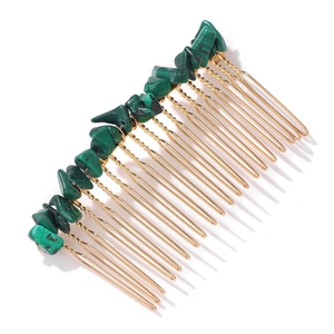 Detail view of 20-tooth golden wire-wrapped hair comb with green natural stone beads