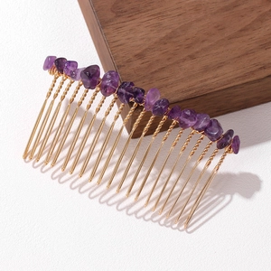 Elegant gold metal hair comb featuring natural purple stone chips on white background
