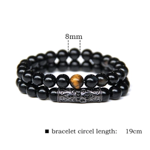 Detail showing 8mm natural stone bead set with 19cm circumference and black metal tube
