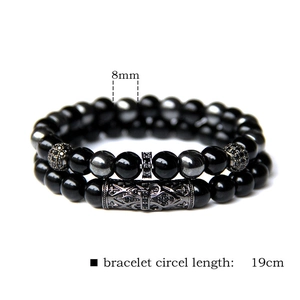 Detail of 8mm black stone bead bracelets set with 19cm length and metal ornaments