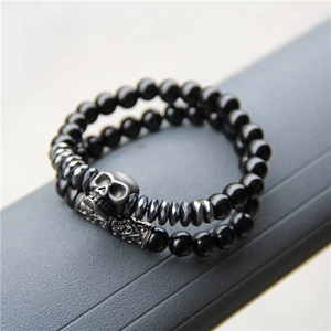 Double-layered punk skull bracelet with natural black stone beads and silver metal details