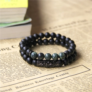 Two-piece natural stone bead bracelet set with vintage cross engraving on matte black onyx beads