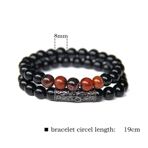 Beaded natural stone bracelet set with 8mm black beads and micro-pave metal tube spacer