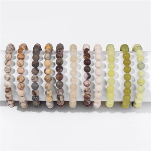 Collection of eleven 8mm natural stone beaded bracelets with various textures and colors