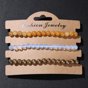Three-piece stretch bead bracelet set with yellow, blue, and gold-coated lava stone beads
