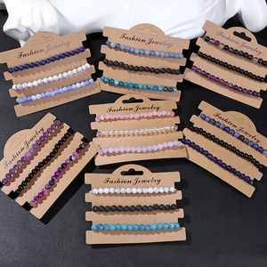 Detail of 4mm natural stone beaded stretch bracelets set on kraft display cards