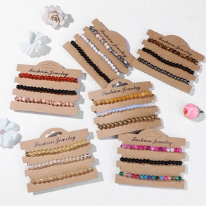 Set of natural stone bead bracelets with tiger eye and obsidian on display cards