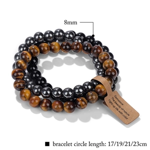Detail view of 8mm tiger eye bead bracelet set with size labels and paper tag