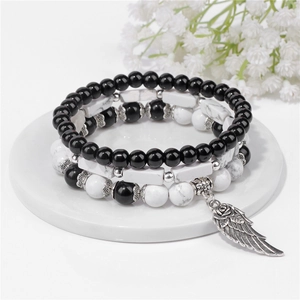 Set di tre bracciali di perle bohémien con turchese bianco e ciondolo ad ala argento