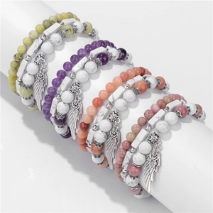 Set di bracciali bohémien multistrato con pietre bianche e ciondoli a forma di ala