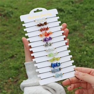 Detailed set of 12 natural crystal stone beaded bracelets on white display cards