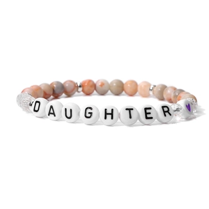Detail of beaded daughter bracelet with marble stone beads and silver heart accents