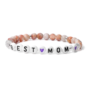 Macro detail of natural stone bead bracelet with BEST MOM lettering and heart charm