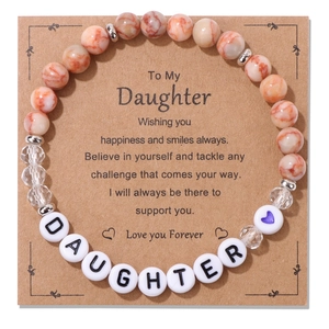 Detailed macro view of Daughter stone beaded bracelet with warm message gift card