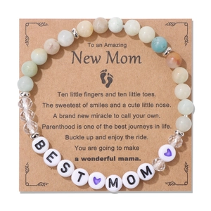 Detailed macro view of BEST MOM letter beads on a natural stone beaded gift bracelet