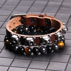 Men's punk bracelet set with brown leather skull studs and tiger eye stone beads