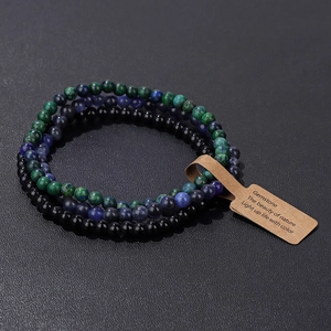 Detail of three natural stone bead bracelets with amethyst, obsidian and paper tag