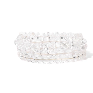 Close-up of three-piece set of transparent natural clear quartz irregular stone bracelets