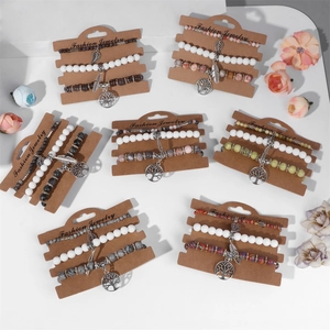 Three-layer bohemian beaded bracelet set featuring Tree of Life and leaf silver charms