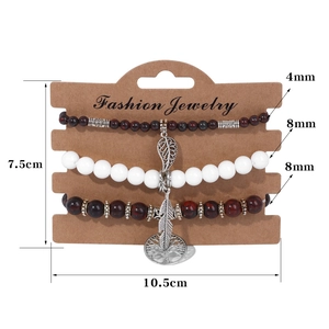 Three-piece ethnic beaded bracelet set with Tree of Life and silver leaf pendants