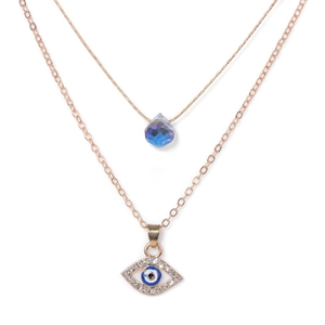 Gold double-layered necklace set with evil eye charm and blue teardrop crystal pendant