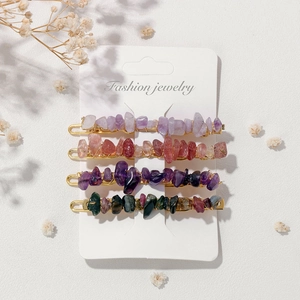 Set of four handmade natural gemstone hair clips with gold alloy base on white display card
