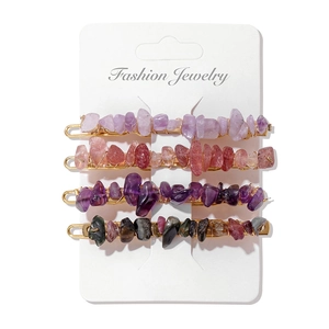 Set of four gold bridal hair clips with natural gemstone chips on display card