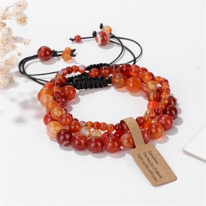 Three-piece red natural gemstone bead bracelets with woven cord and descriptive gift card