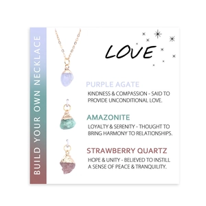 Detail of natural purple agate, amazonite and strawberry quartz pendants with gold rims