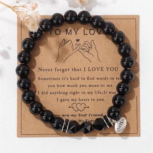Detail of 8mm faceted black stone beads with heart-shaped WISH pendant and gift card