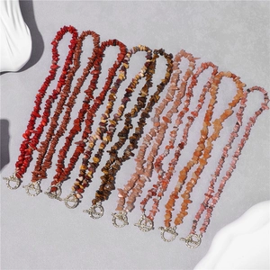 Detail showing various natural crushed stone necklaces with silver OT buckle closures