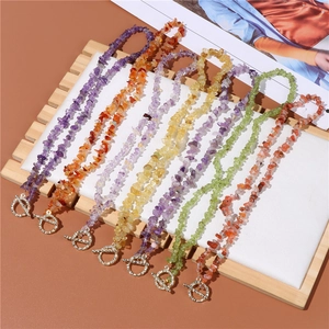 Detail of colorful irregular gravel bead necklaces featuring a silver toggle OT clasp