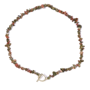 Detailed close-up of natural unpolished gemstone necklace with a textured gold OT toggle clasp