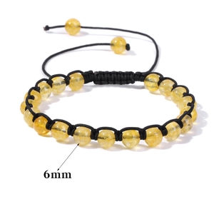 Bracciale intrecciato in perle di pietra gialla da 6mm con cordino nero regolabile