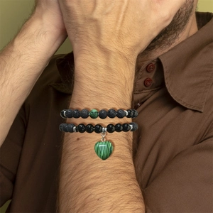 Detail of double-layer beaded bracelet with volcanic stone and heart malachite pendant