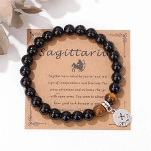 Pulsera Sagitario de cuentas de ojo de tigre en tarjeta vintage con colgante optimist