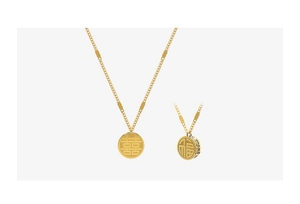 Close-up of 18k gold pendant necklaces featuring Chinese Xi and Fu characters with zircons