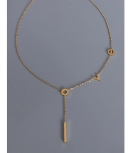 Detail of 18k gold plated Y-shaped necklace with LOVE letters and vertical bar pendant
