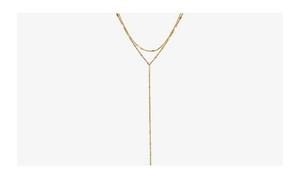 Detail of double-layer gold Y-necklace with small rectangular charms and long tassels