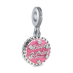 Detailed close-up of pink enamel birthday cake charm with Happy Birthday inscription