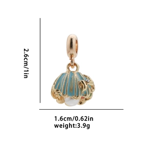 Detailed view of a gold shell pendant with light blue enamel, white pearl, and dimensions