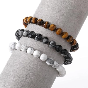 Three-piece 8mm natural stone bead bracelet set featuring tiger eye and howlite stones