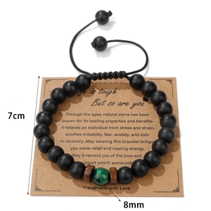 Bracciale regolabile con perline occhio di tigre da 8mm e pietre nere opache su carta