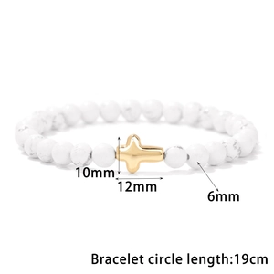 Detail view of 6mm white stone beads with a 10mm golden cross pendant measurement